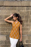 Maya Kurti mustard halter neck kurti in Taj cotton with ethnic block print